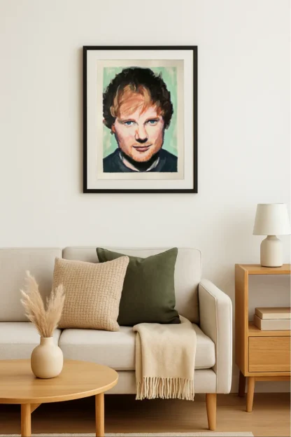 Ed Sheeran art print displayed in a modern Scandinavian living room above a sofa
